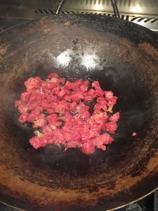 Saute diced Chinese sausage