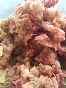 Coarely ground pork sprinkled with marinade