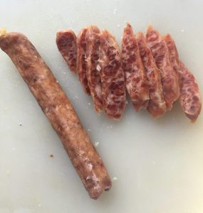 Sliced Chinese sausage at a diagonal