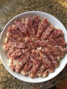 Marinated coarsely ground pork pressed into dish and topped with Chinese sausage.