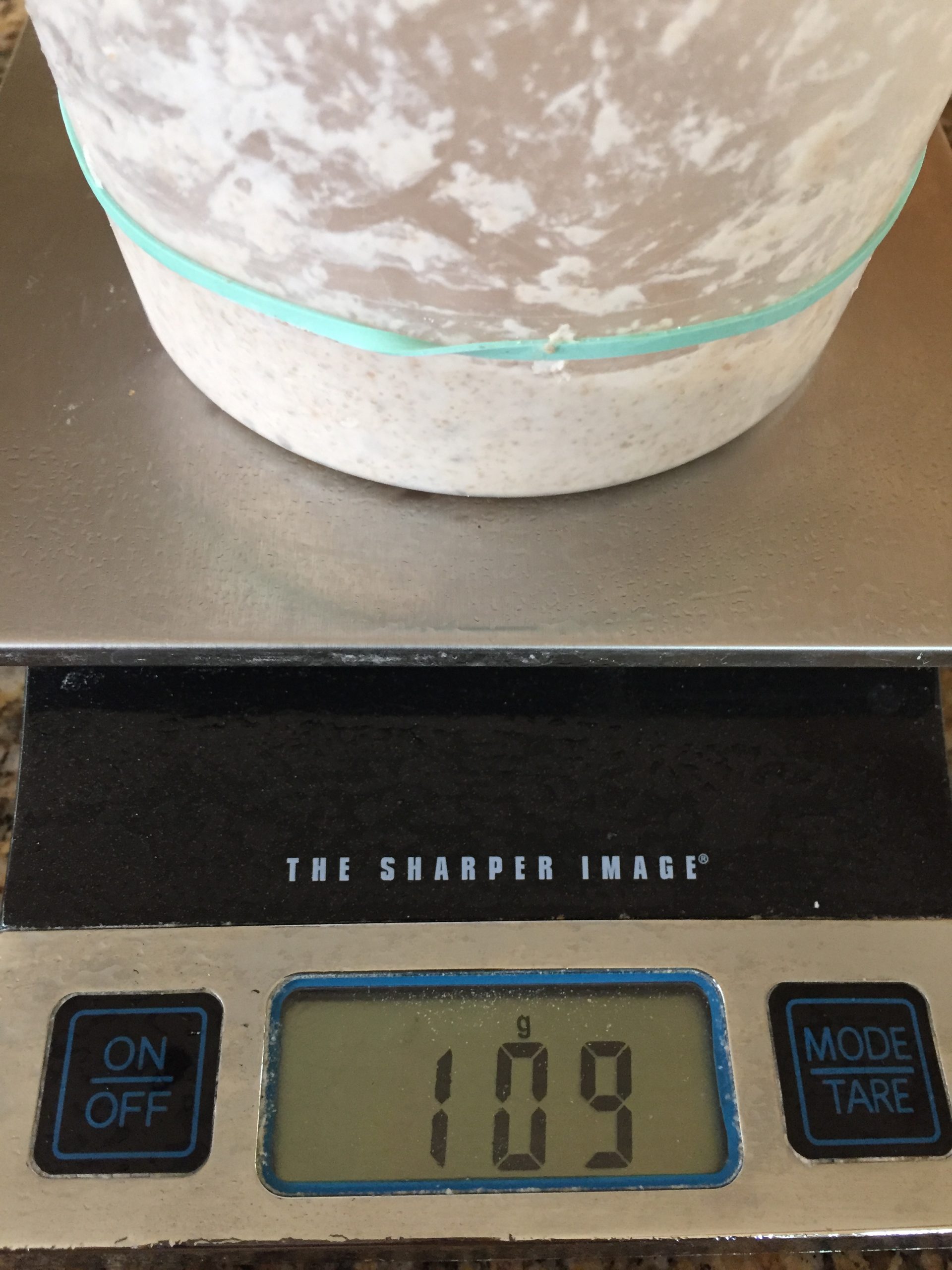Weighing levain in container on scale