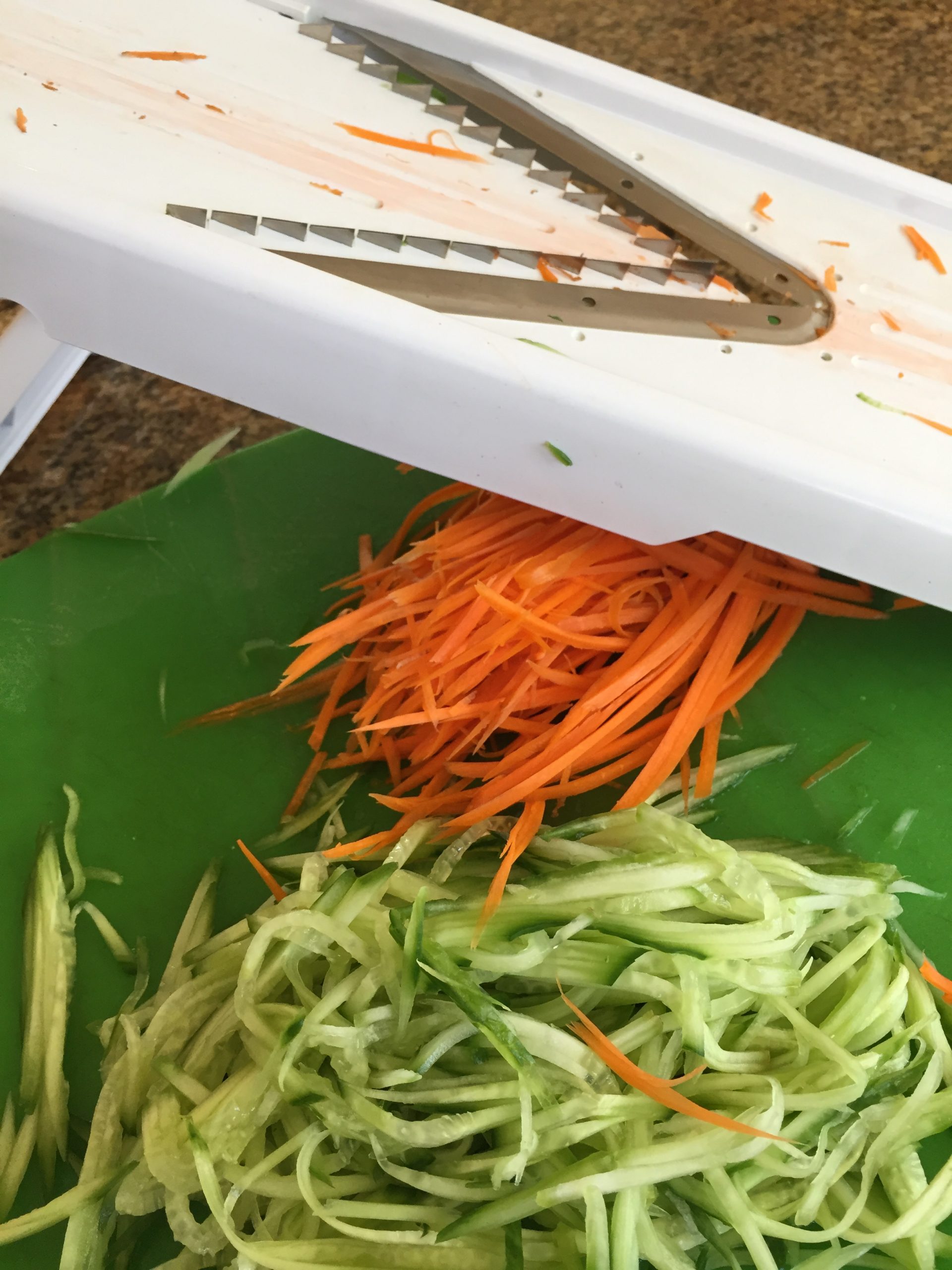 Julienne cut carrots and cucumber with mandoline slicer
