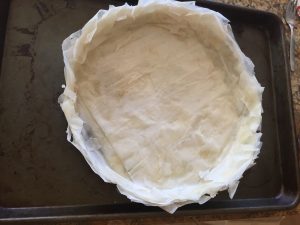 Phyllo pastry tart shell on cookie sheet