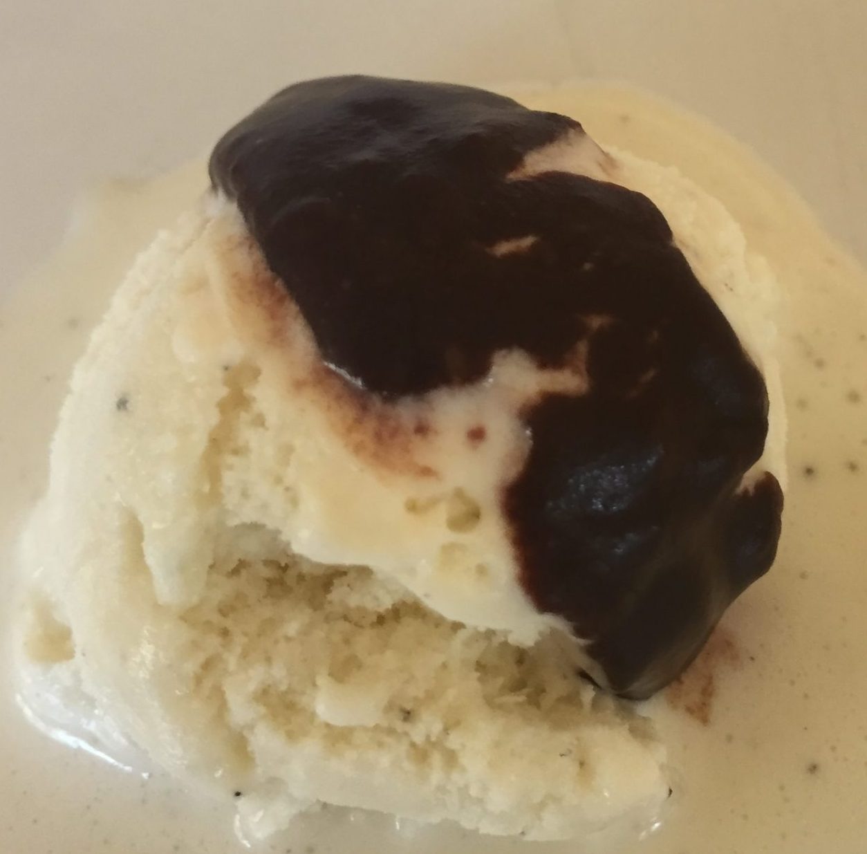 Melted chocolate sauce (with water) on ice cream.