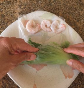 Fold the sides of the rice wrapper.