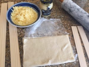 Cheese twist ingredients of puff pastry, cheese, dijon mustard