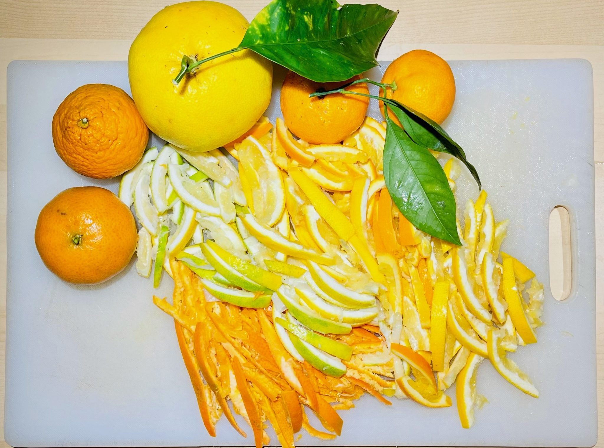 Cut citrus into strips.