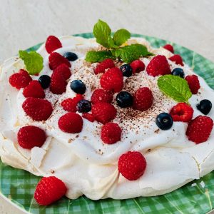 Pavlova with fresh cream and berries