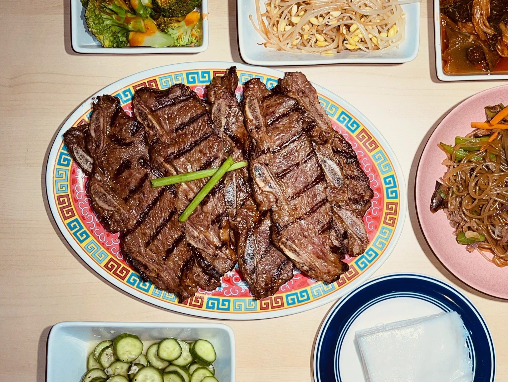 Korean grilled short ribs (galbi) with accompaniments (panchan)