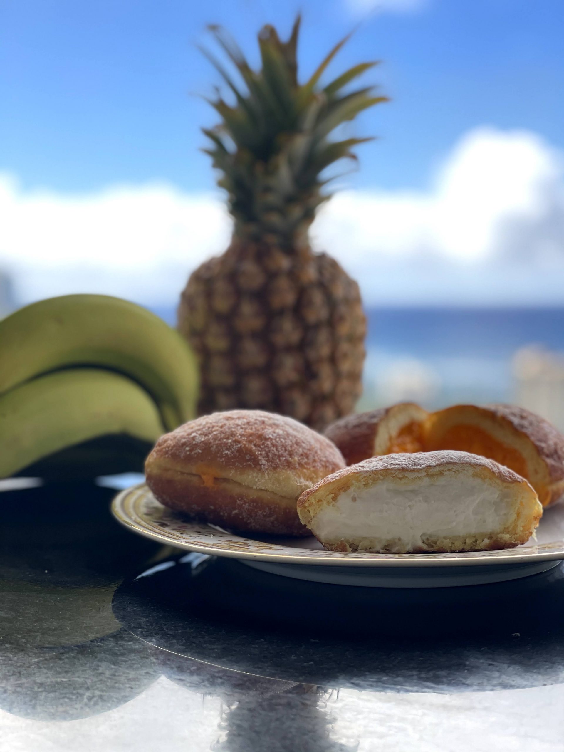 Coconut cream and lilikoi (passion fruit) malasadas