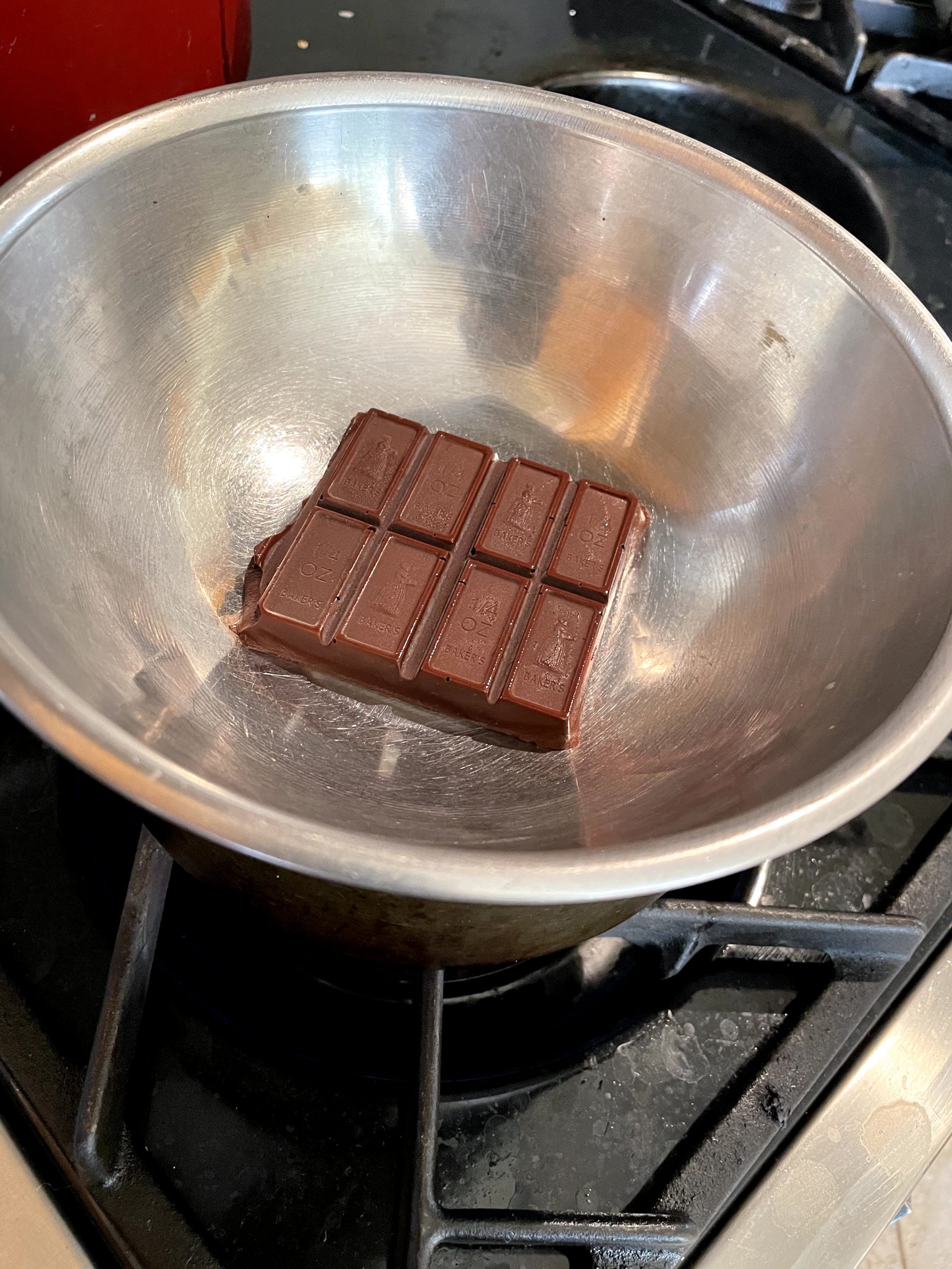 Melt bakers chocolate in a double boiler