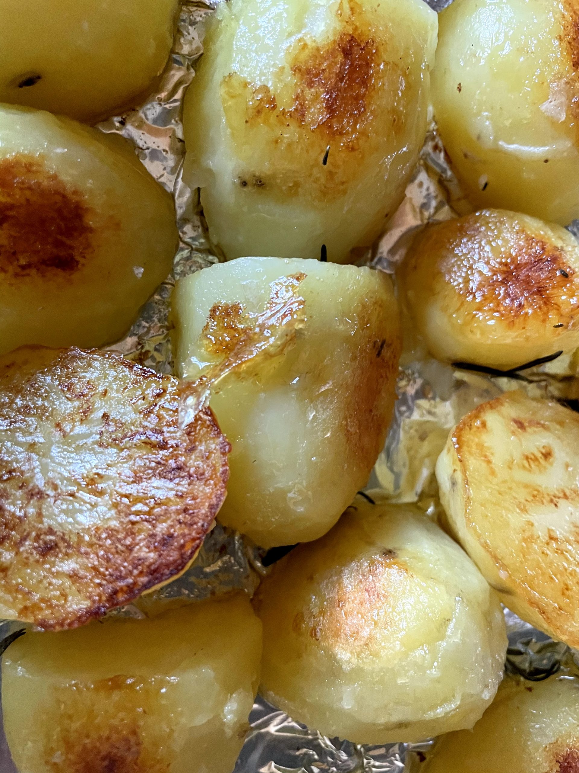 Potatoes individually turned to ensure even browning.