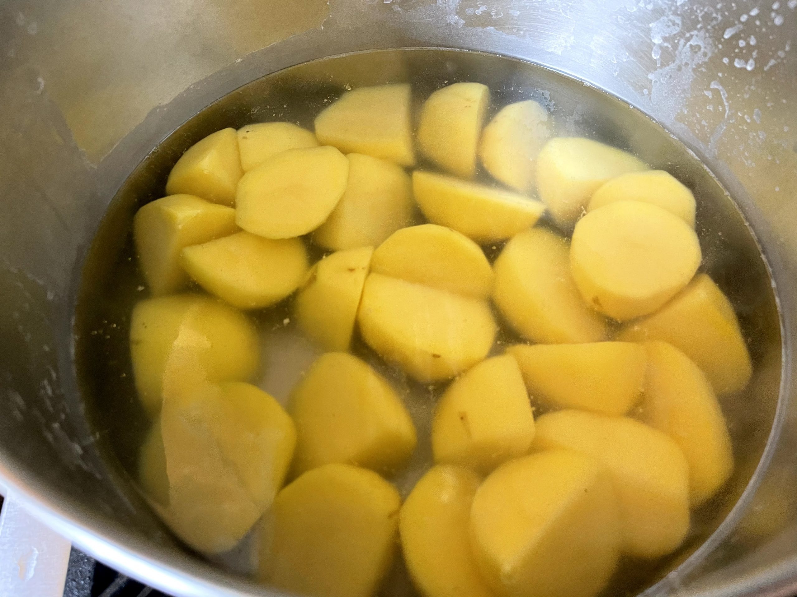 Par boil cut potatoes.