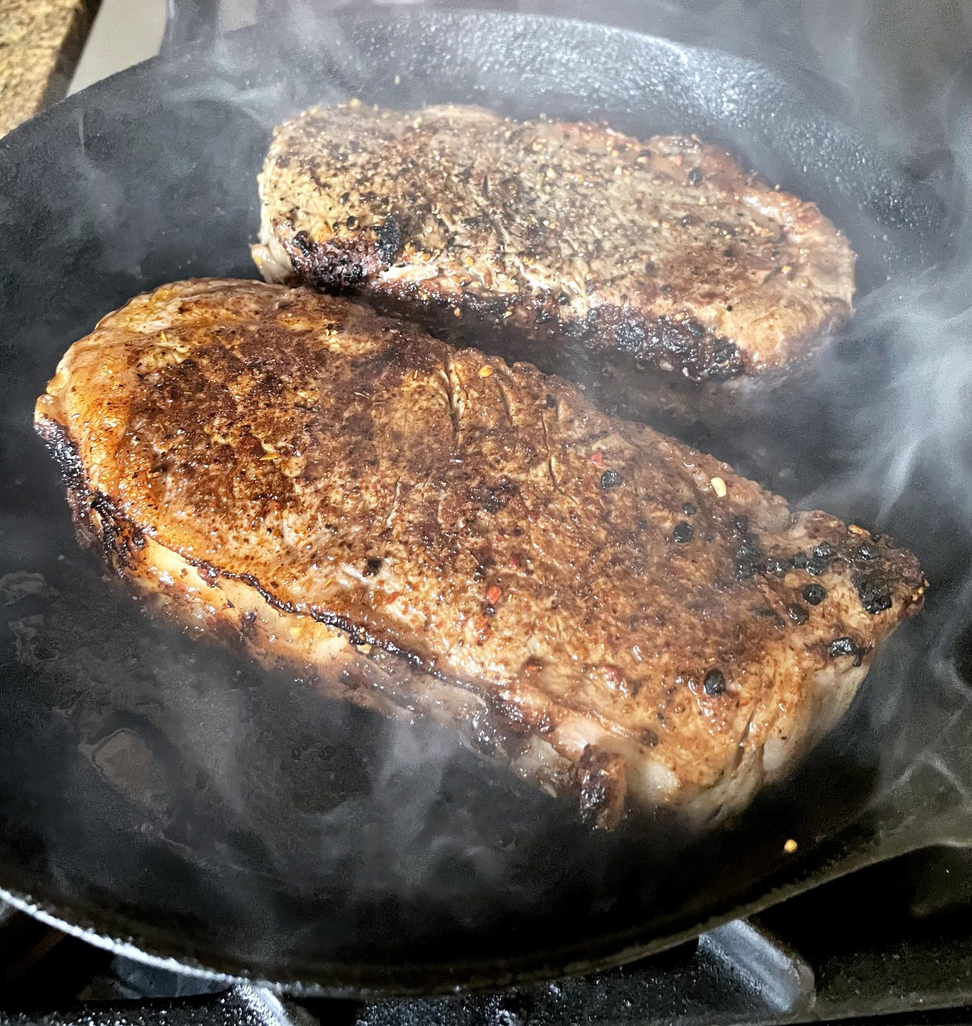 Sear steaks on a HOT cast iron skillet.