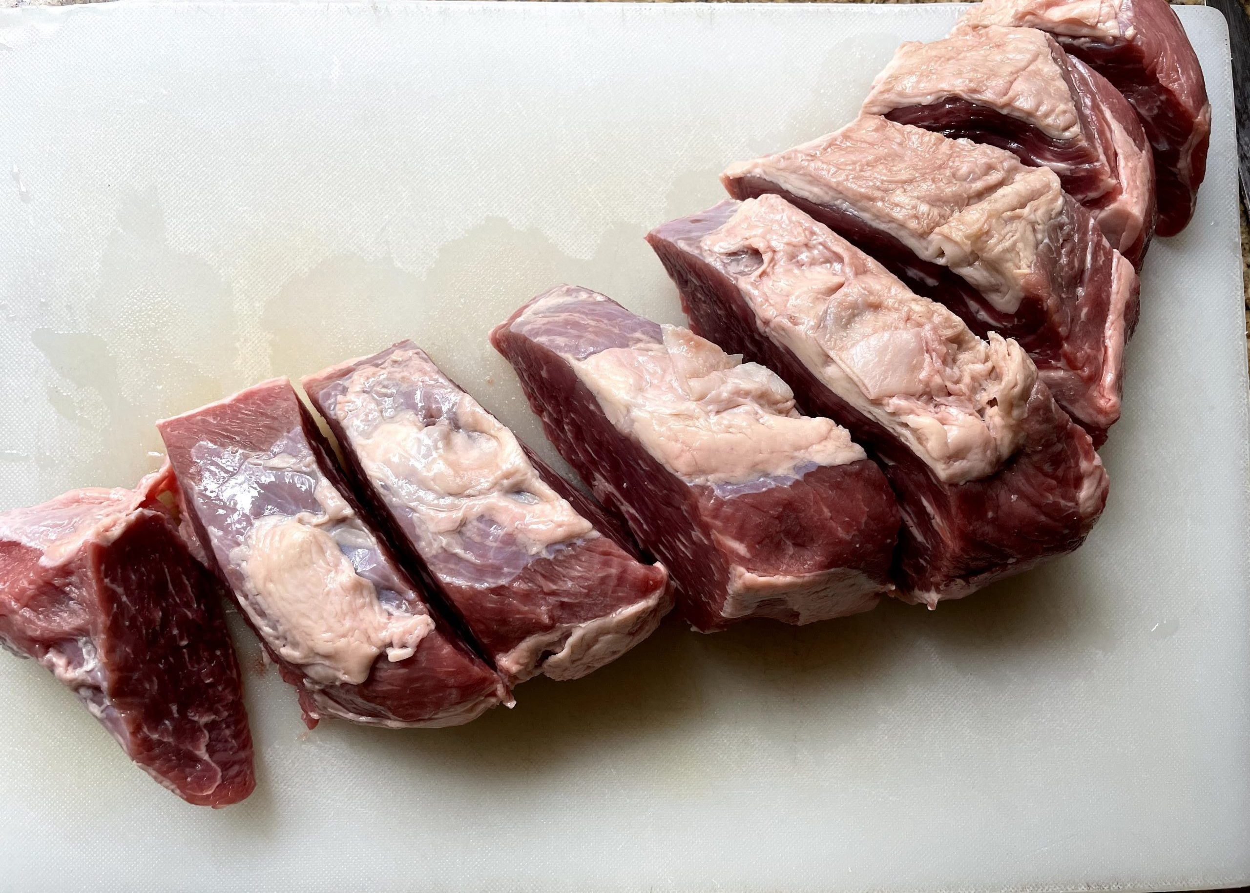 Tri-tip roast cut into steaks