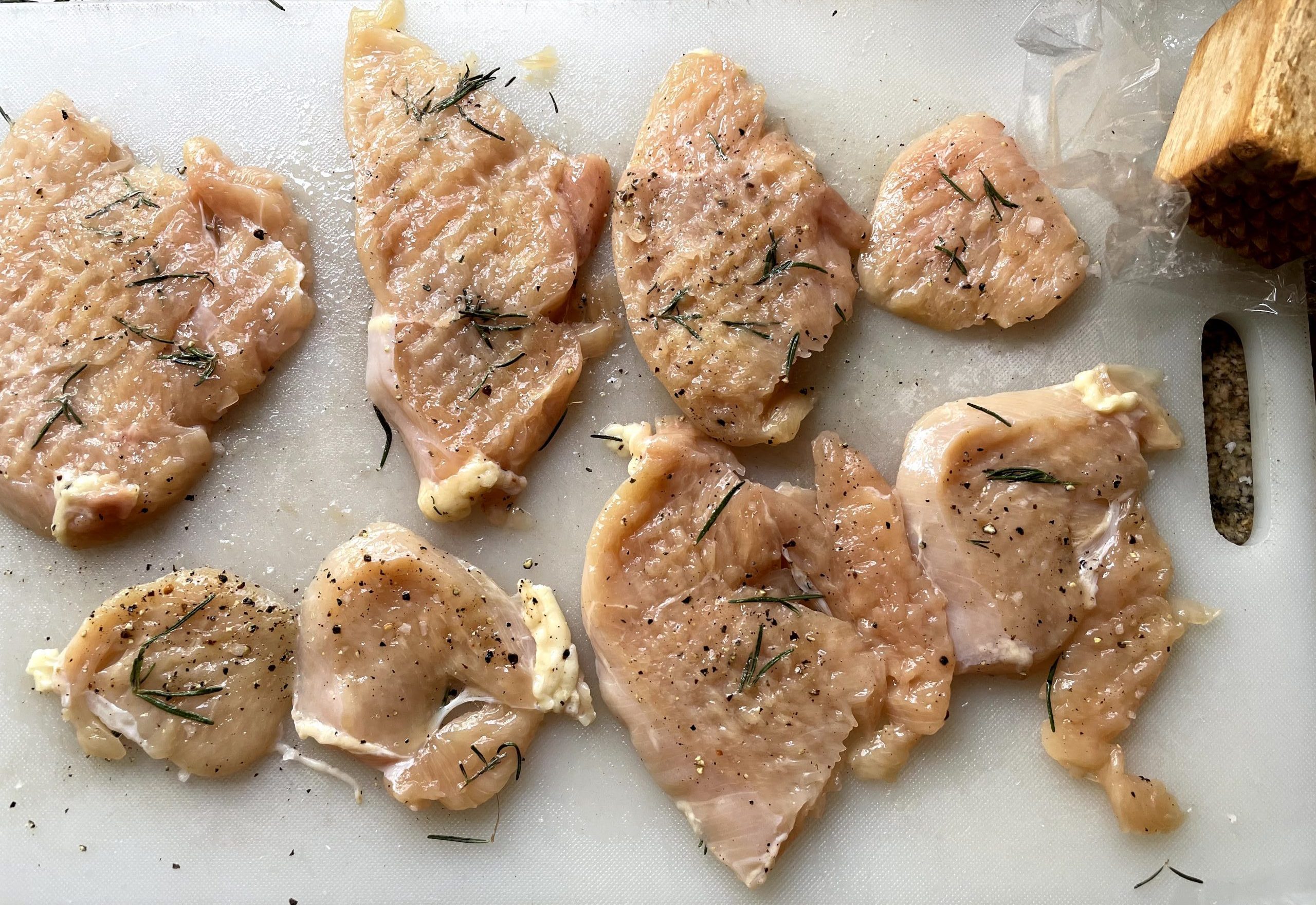 Pounded chicken seasoned with salt, pepper and fresh herbs.