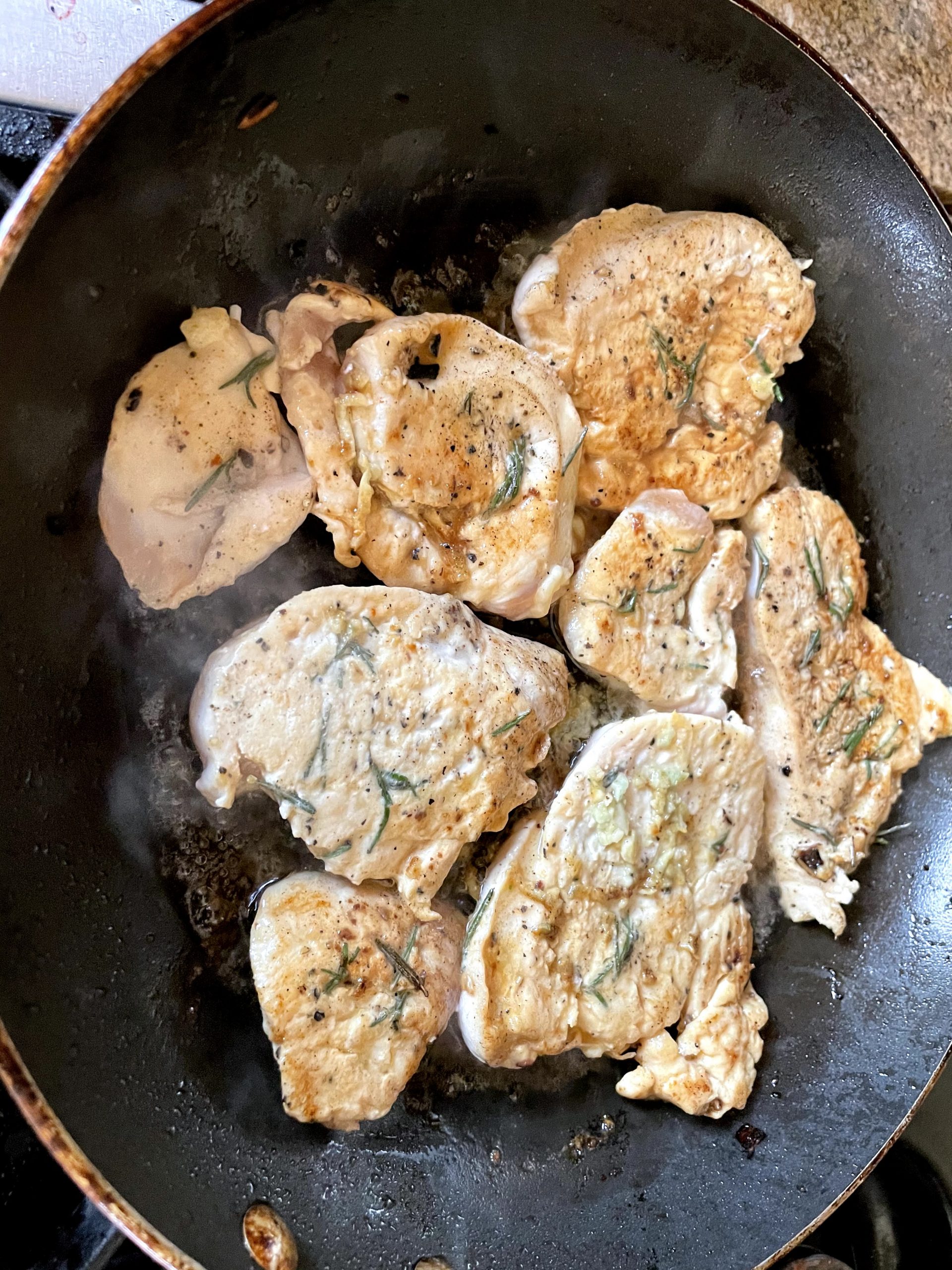 Frying the cutlets in a olive oil, butter mixture.