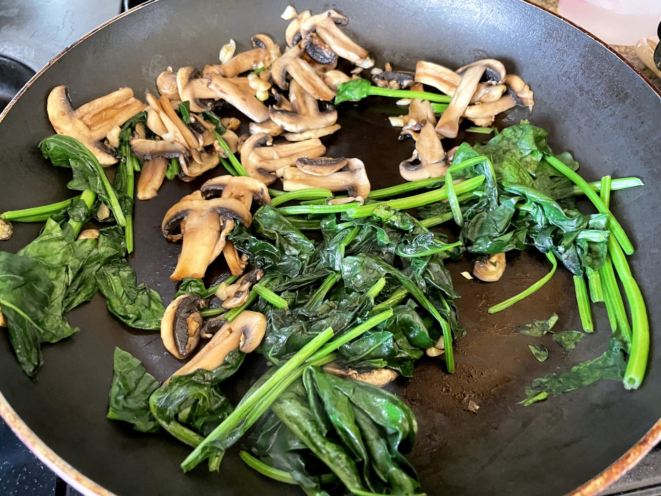 Saute mushrooms and spinach