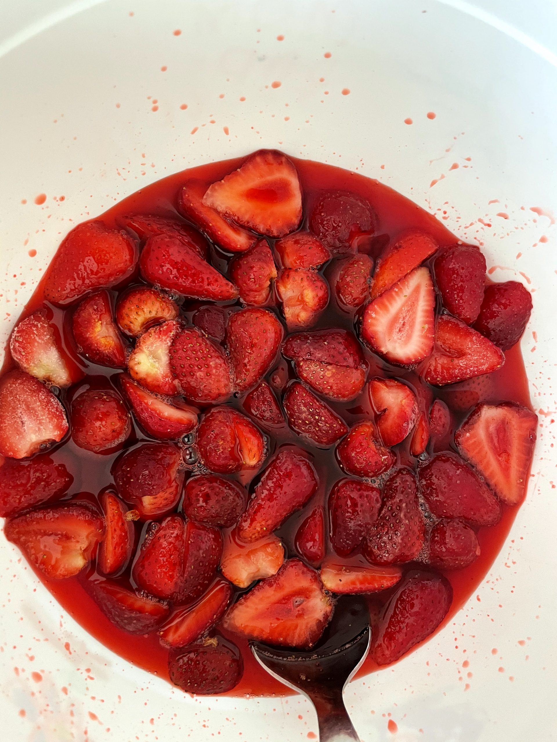 Jello sets when frozen strawberries are added.