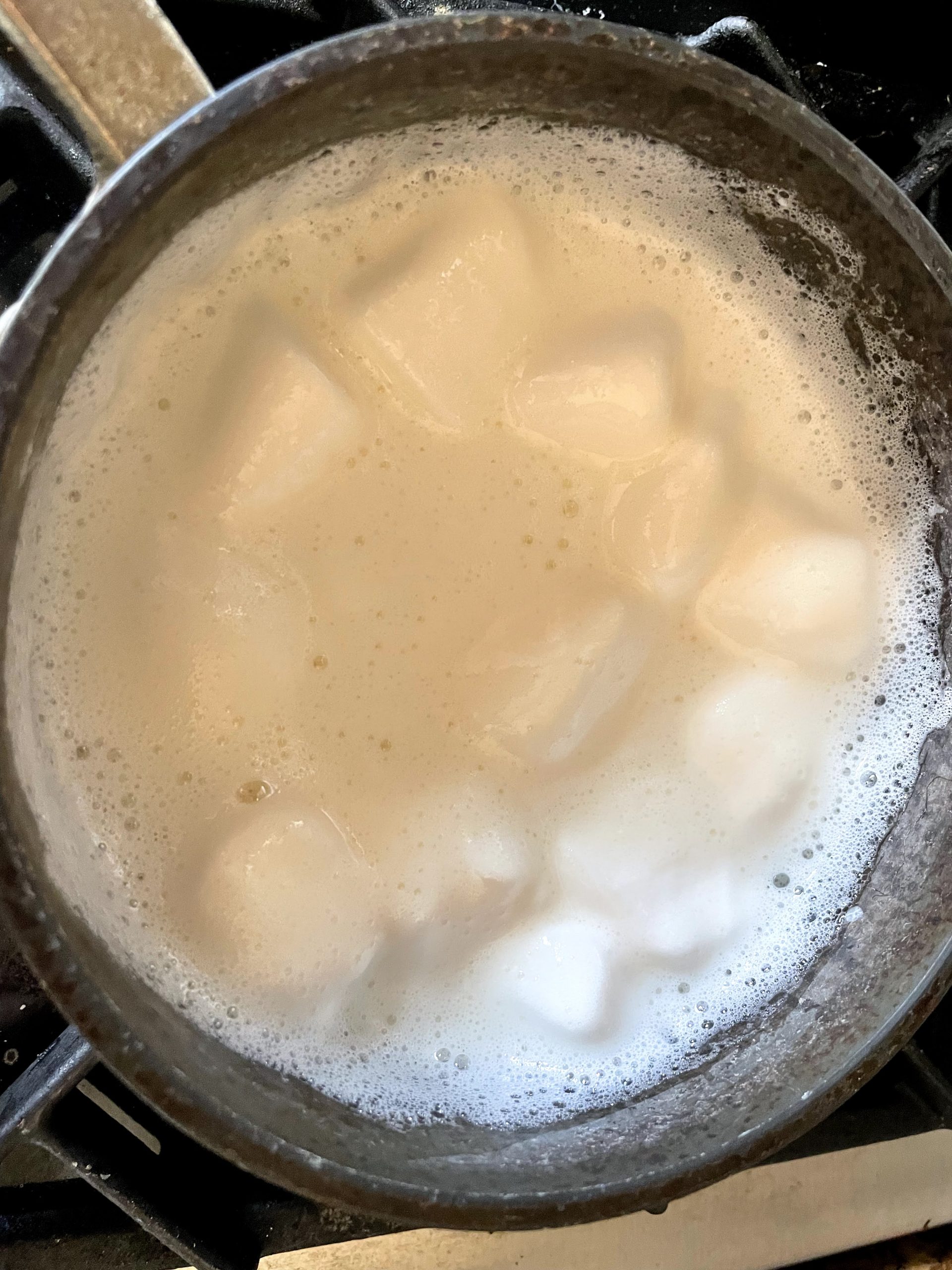 Melt marshmallows in a saucepan with milk.