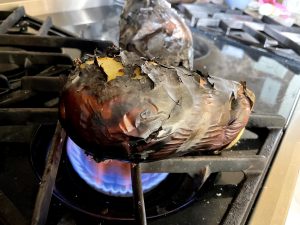 Gilling eggplant on gas stovetop