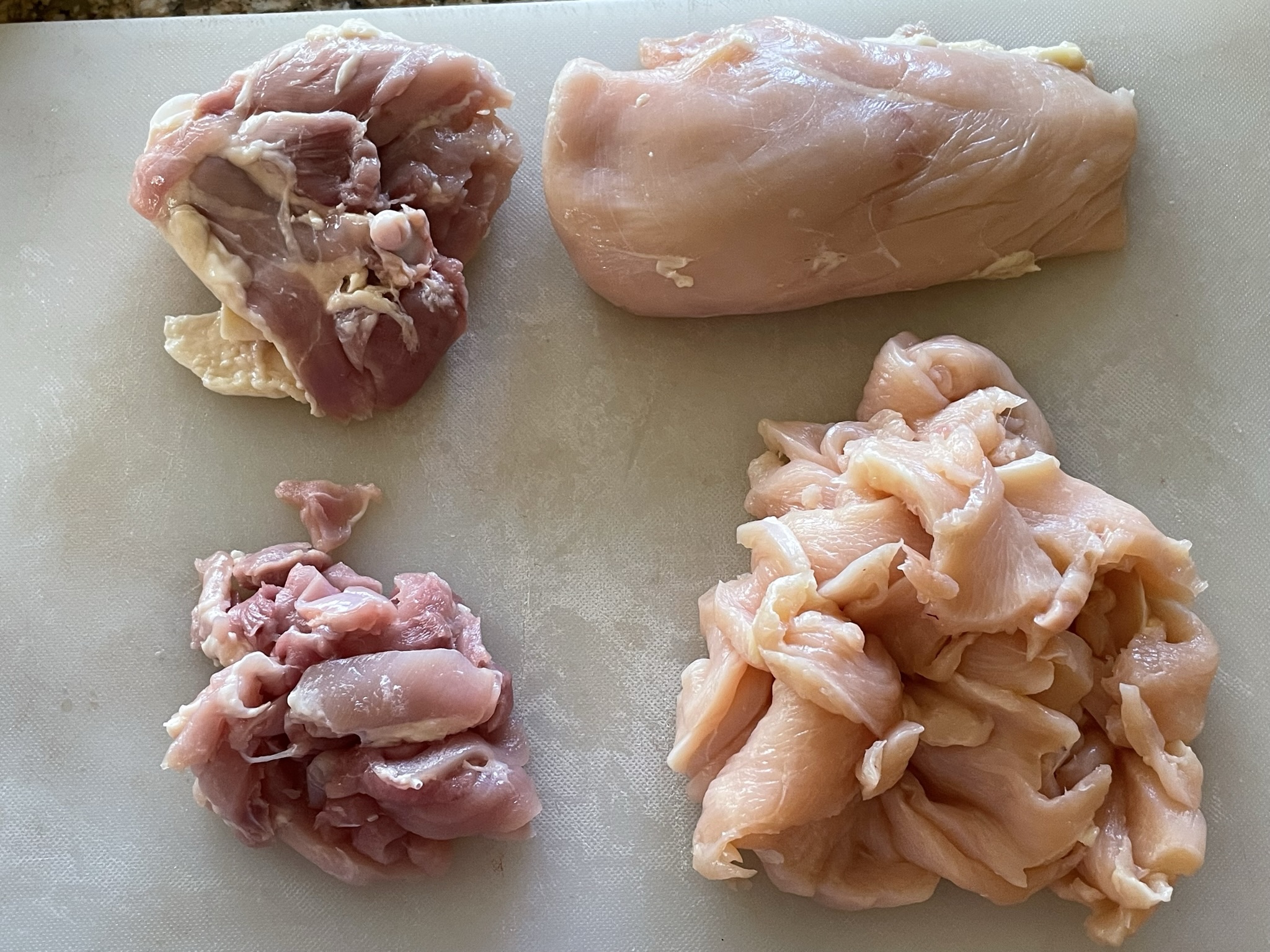 Cutting chicken breast and thigh for stir fry