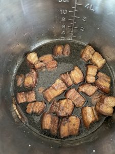 Diluted soy sauce chicken mixture added to pork belly.