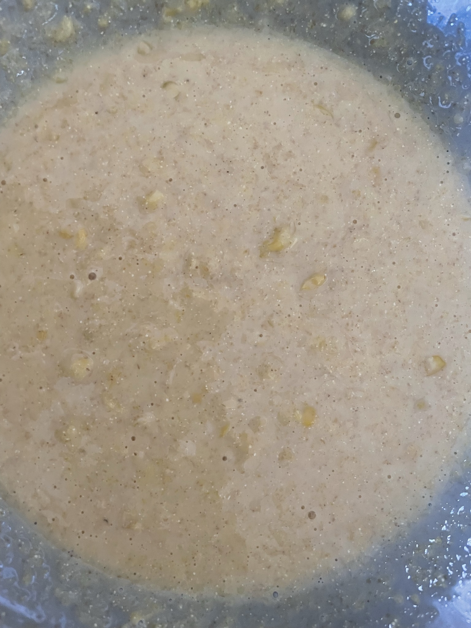Combine cornmeal and creamed corn.
