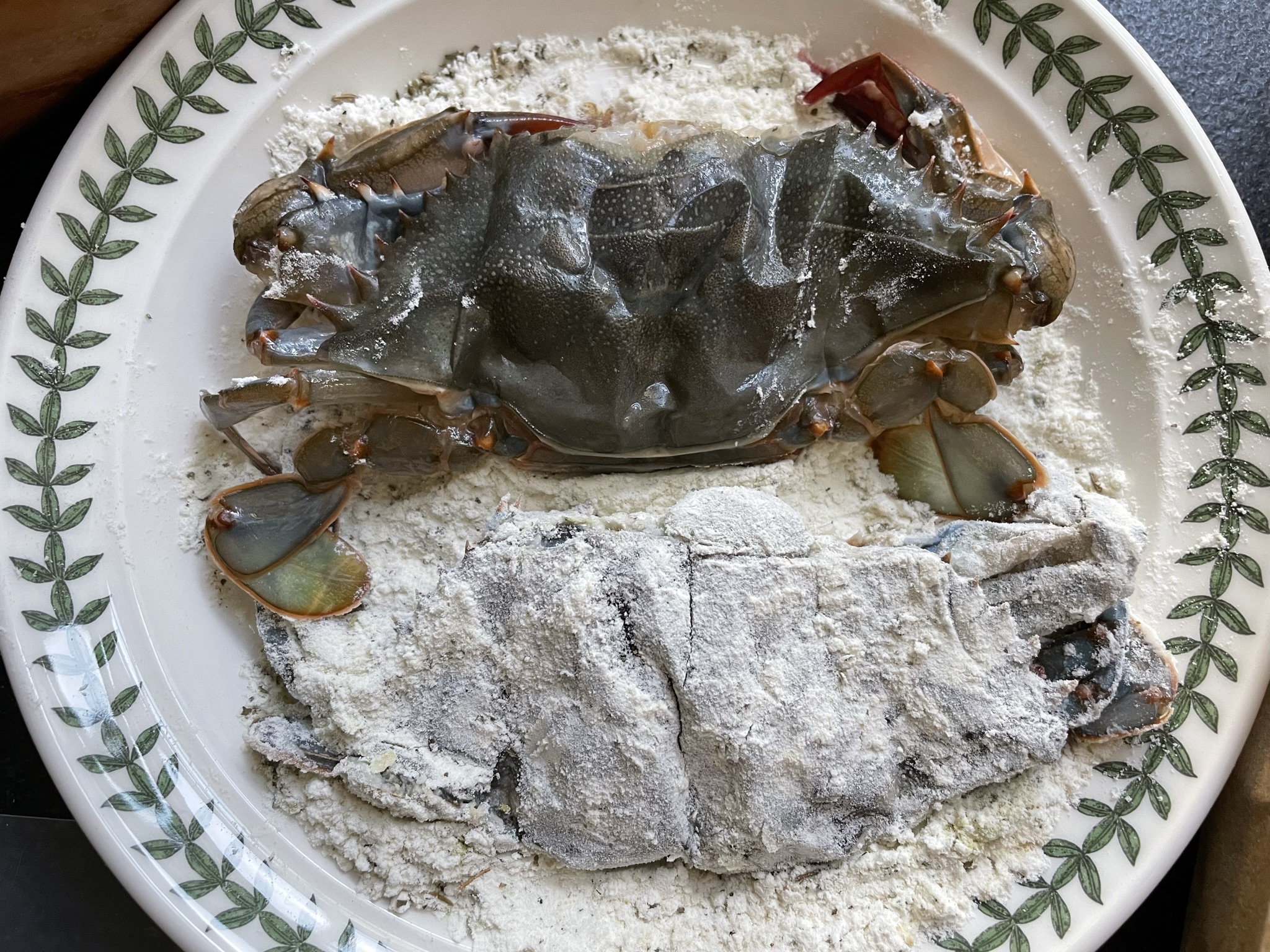 Dredge softshell crab in flour mixture