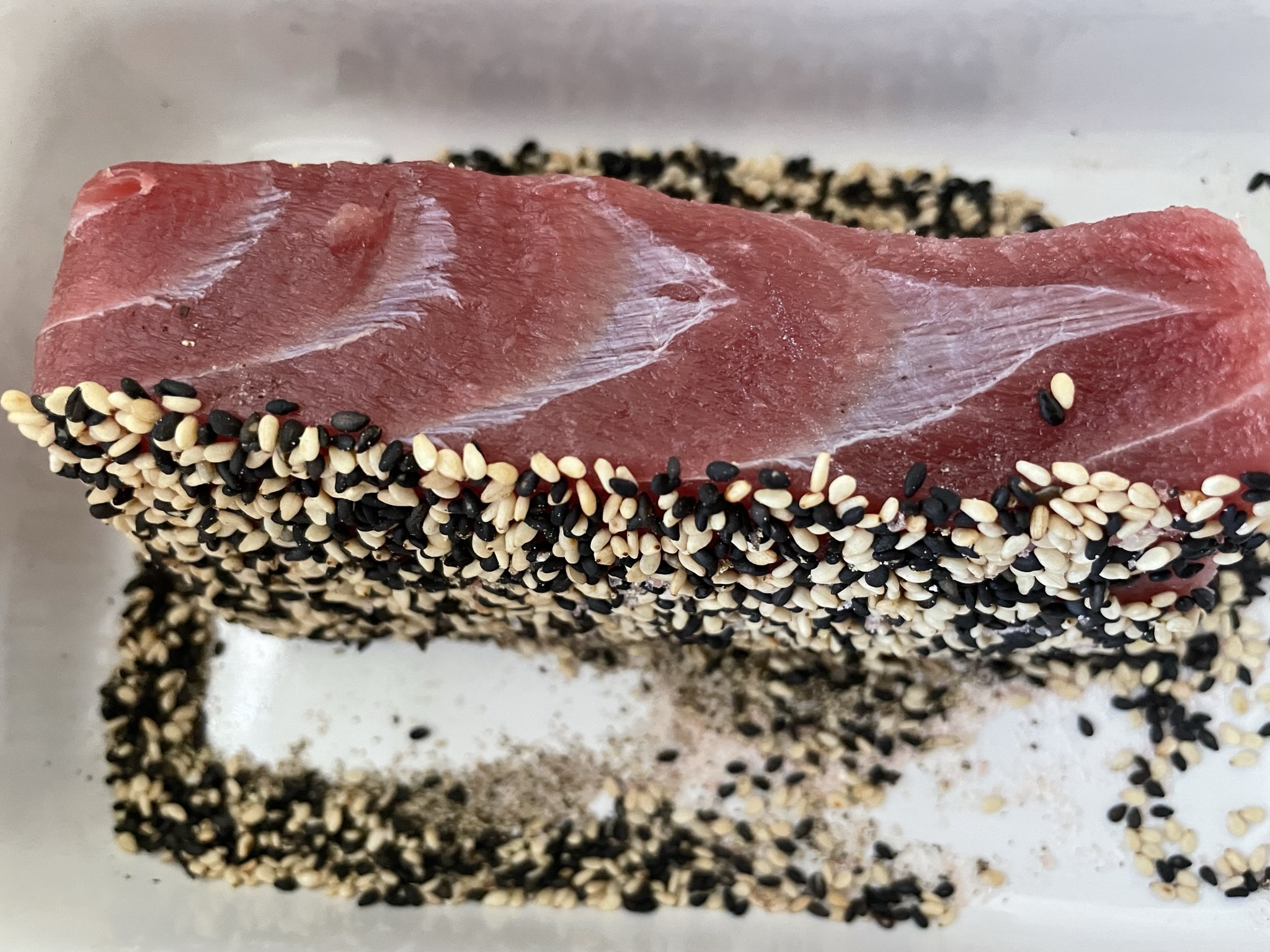 Coat tuna with sesame