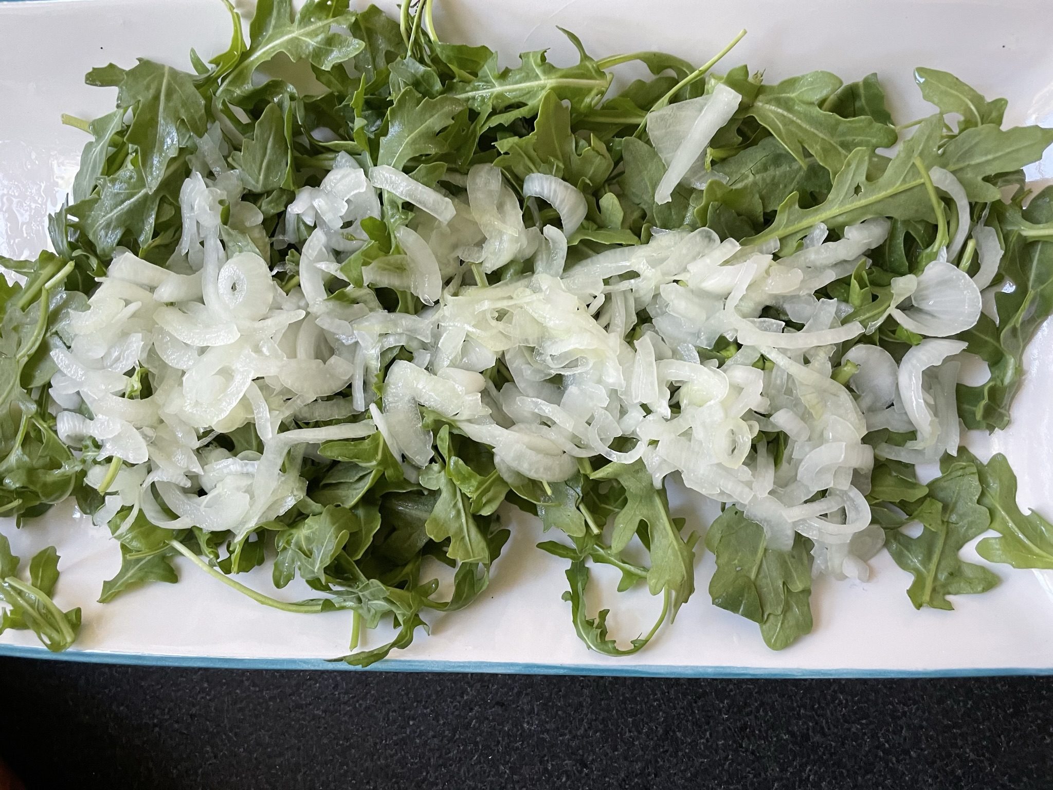 Arugula with pickled onions