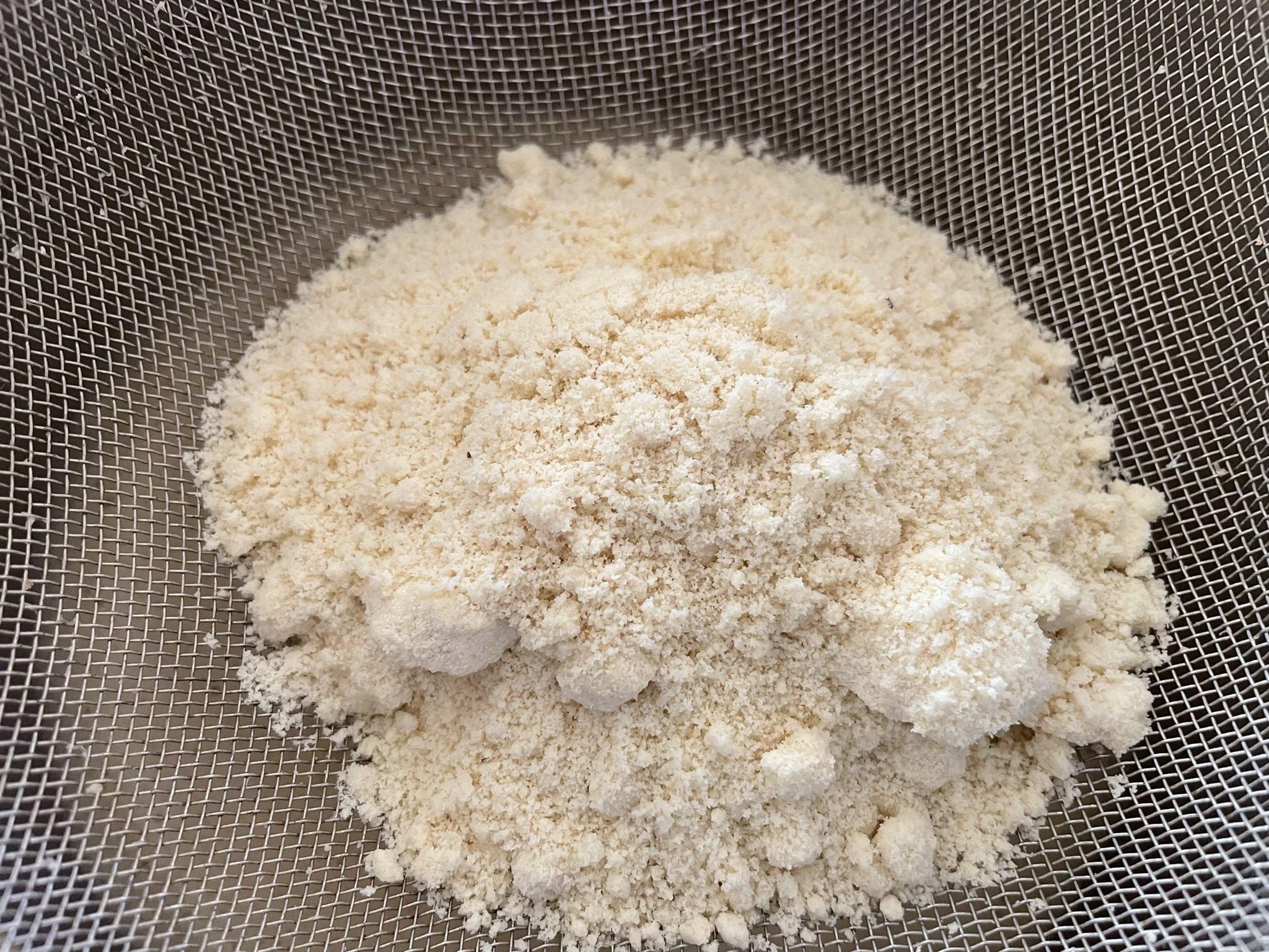 Sieve almond flour to prevent lumps in batter.