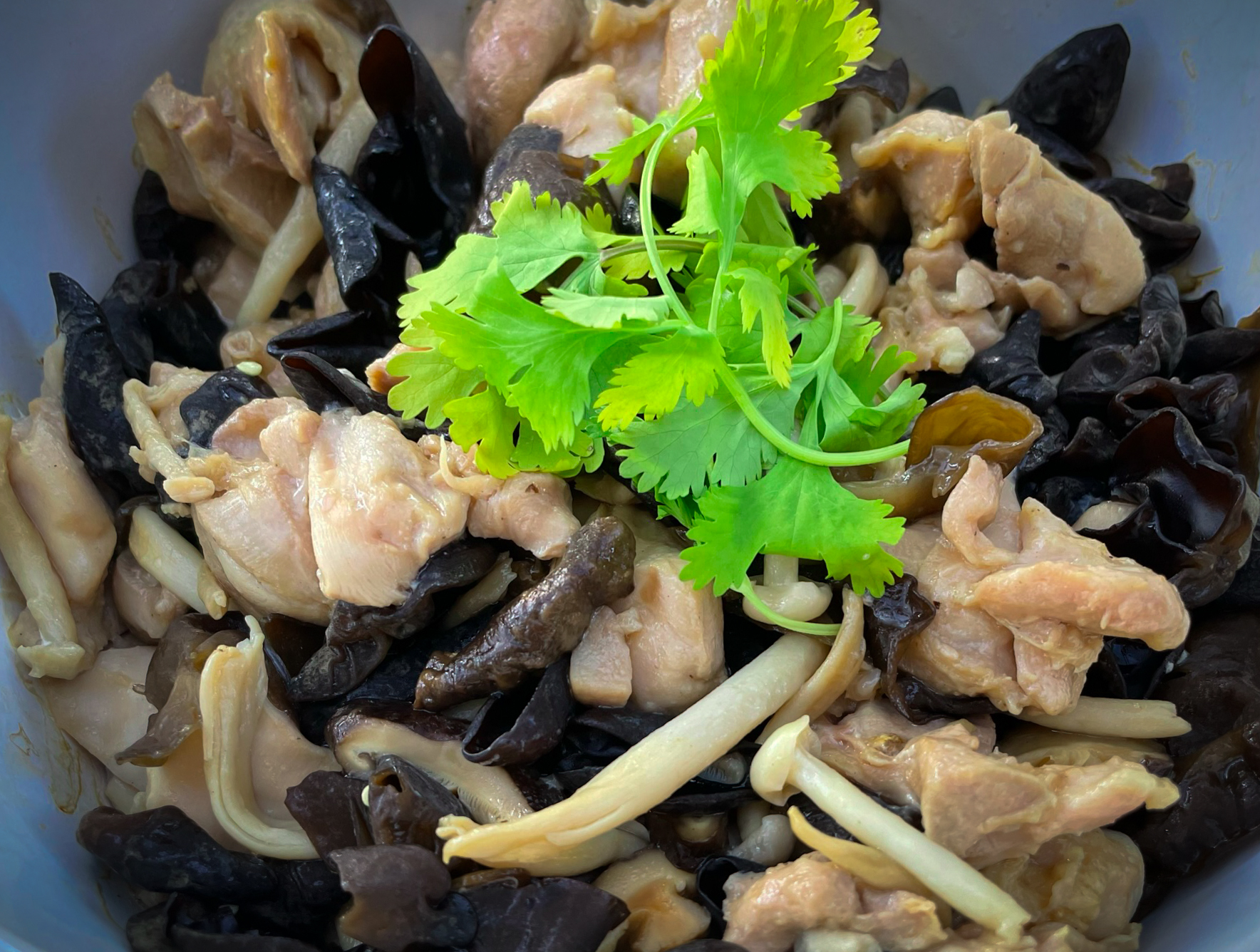 Homestyle Cantonese steamed chicken with mushrooms.