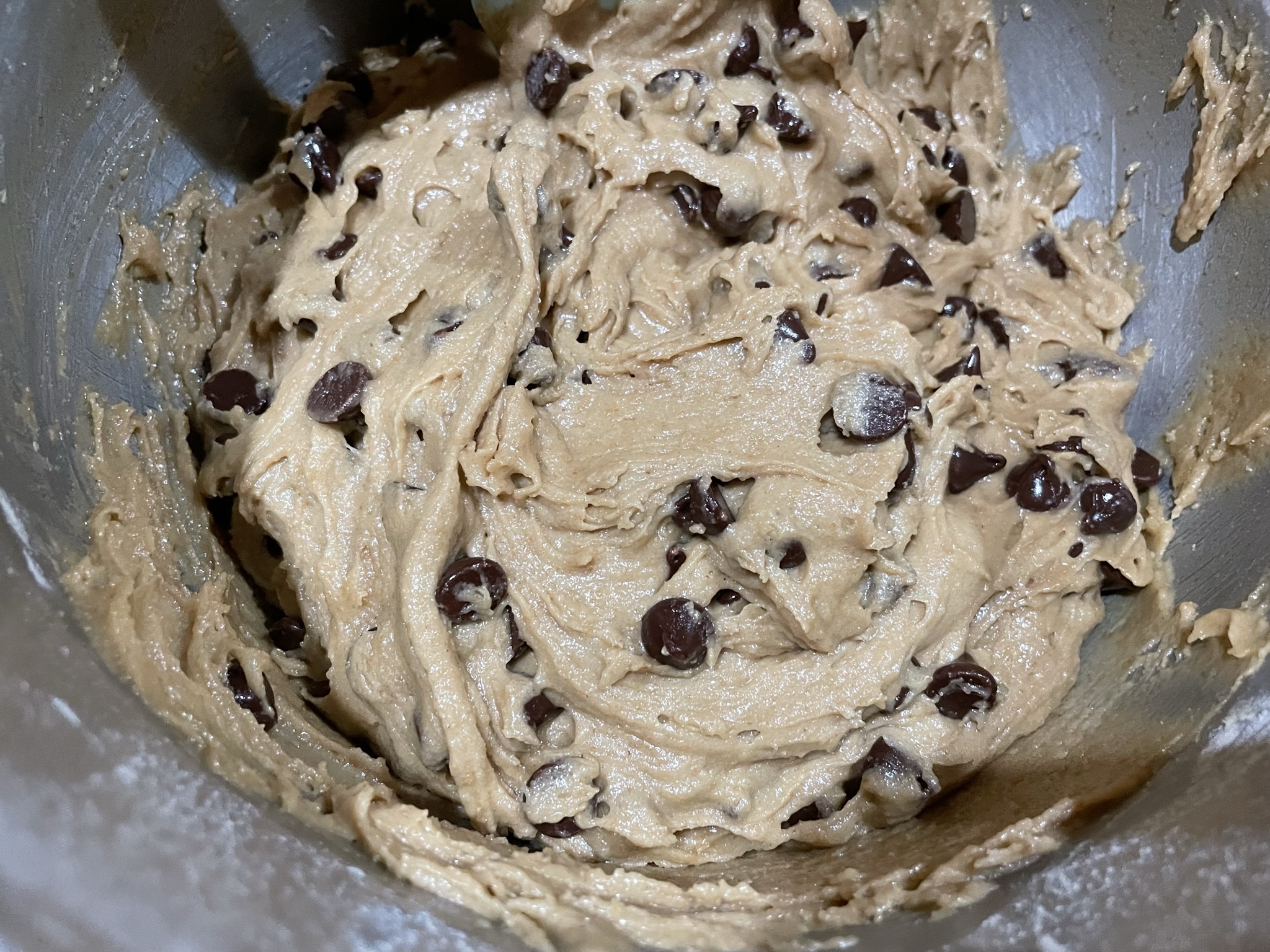 Combine chocolate chips into cookie batter.