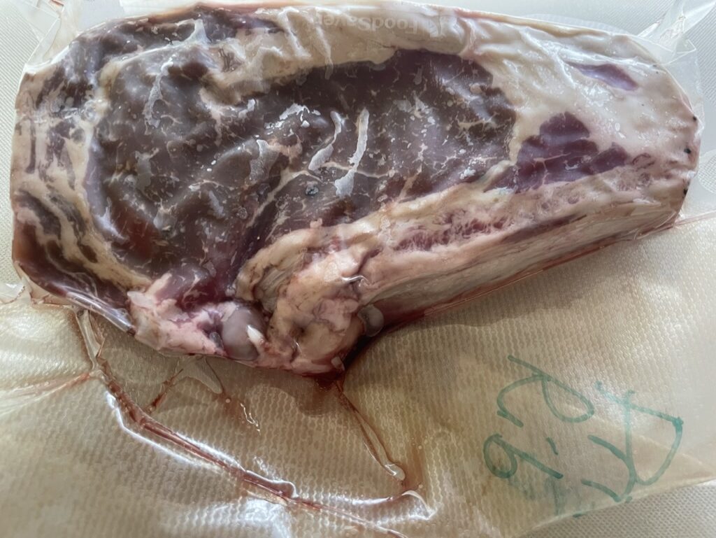 Vacuum sealed prime rib steak.