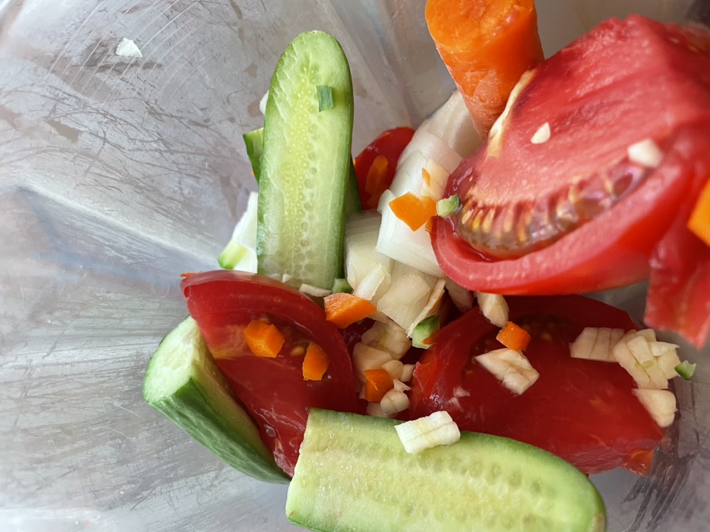 Roughly chopped veggies in a blender Roughly chopped veggies in a blender